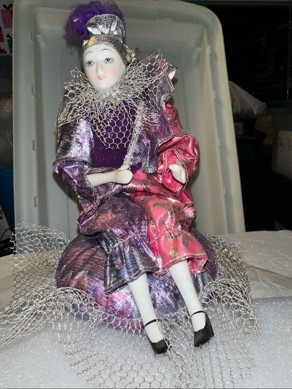 Beautiful vintage porcelain jester musical doll on pillow